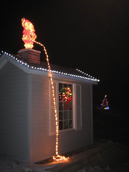 funny christmas lights picture santa pee